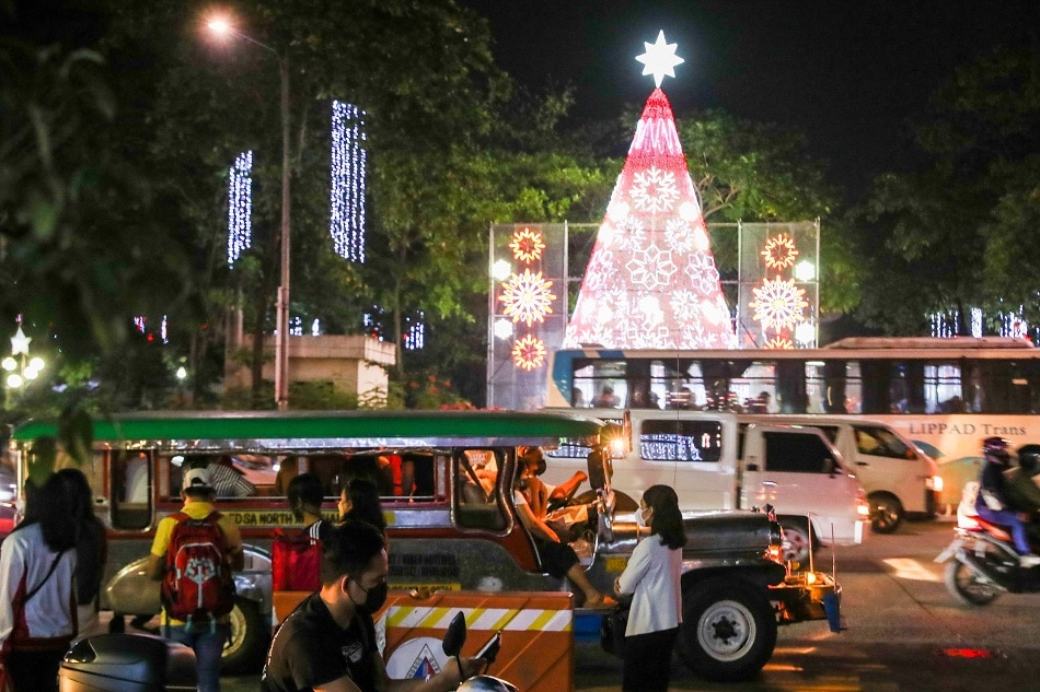 People enjoy a Christmas display at the Quezon City city hall on Nov. 26, 2021 amid the COVID-19 pandemic. Jonathan Cellona, ABS-CBN News/File 