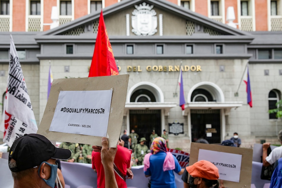 Protesters led by the Campaign Against the Return of the Marcoses and Martial Law (CARMMA) trooped to the Commission on Elections (COMELEC) headquarters in Intramuros, Manila on November 26, 2021. The group continues to urge the COMELEC to disqualify Ferdinand 'Bongbong' Marcos Jr. as the commission’s Second Division hears the first petition to cancel the certificate of his candidacy for president. George Calvelo, ABS-CBN News