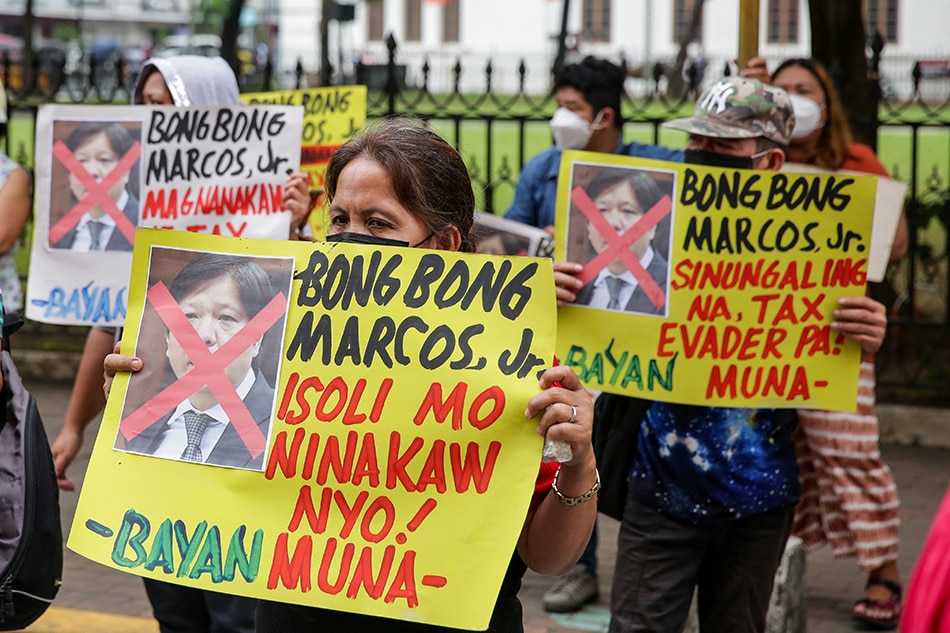 Protesters led by the Campaign Against the Return of the Marcoses and Martial Law (CARMMA) trooped to the Commission on Elections (COMELEC) headquarters in Intramuros, Manila on November 26, 2021. The group continues to urge the COMELEC to disqualify Ferdinand 'Bongbong' Marcos Jr. as the commission’s Second Division hears the first petition to cancel the certificate of his candidacy for president. George Calvelo, ABS-CBN News/File
