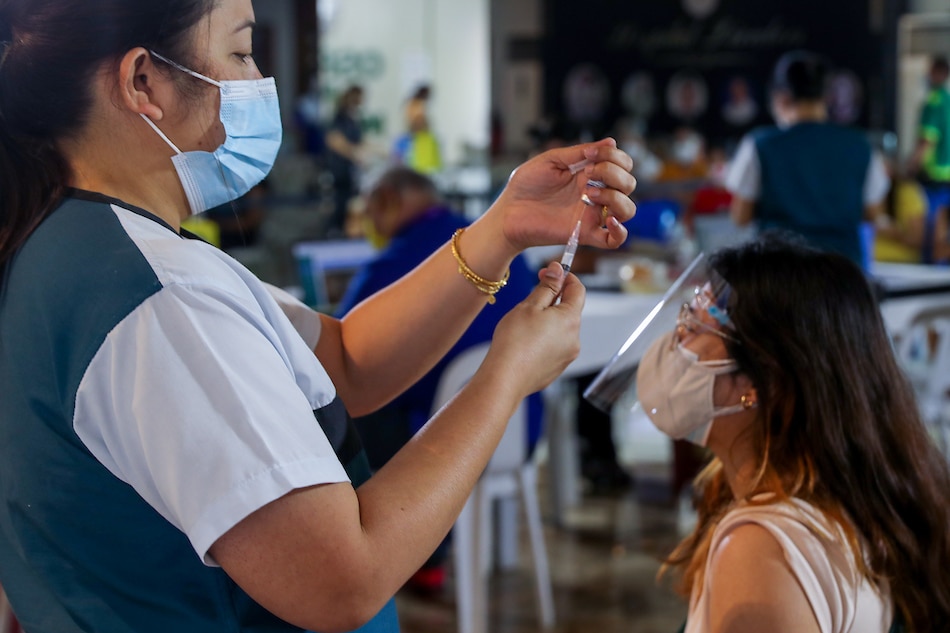 People get their vaccines at the Ospital ng Maynila during the roll-out of the National Vaccination Days on November 29, 2021, in Manila. Jonathan Cellona, ABS-CBN News