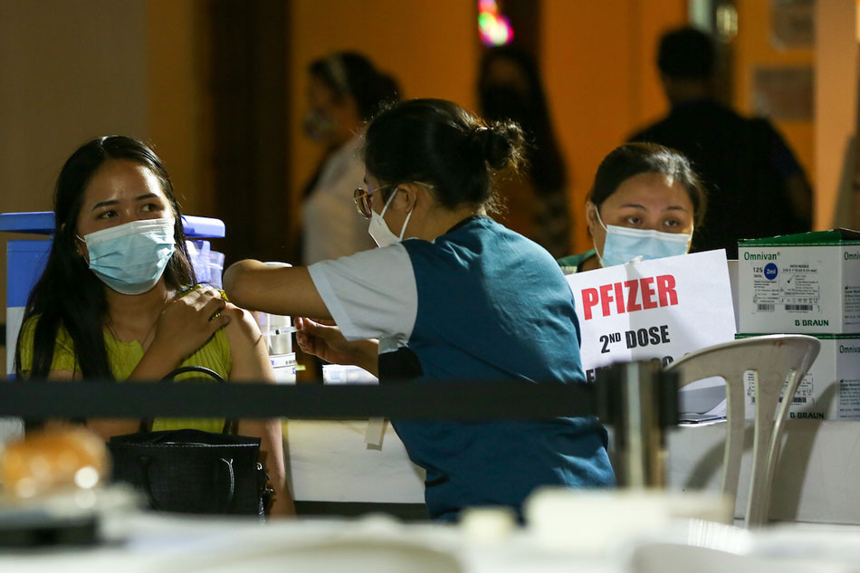 People get their vaccines at the Ospital ng Maynila during the roll-out of the National Vaccination Days on November 29, 2021 in Manila. Jonathan Cellona, ABS-CBN News