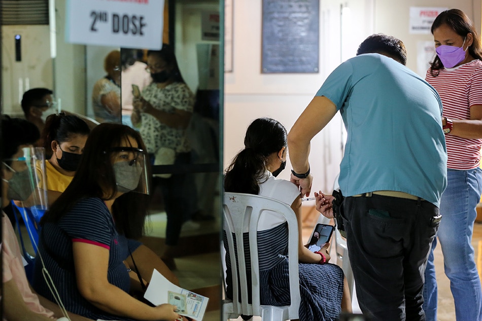 People are reflected on the mirror as others get their vaccines at the Ospital ng Maynila during the roll-out of the National Vaccination Days on November 29, 2021 in Manila. Jonathan Cellona, ABS-CBN News/File