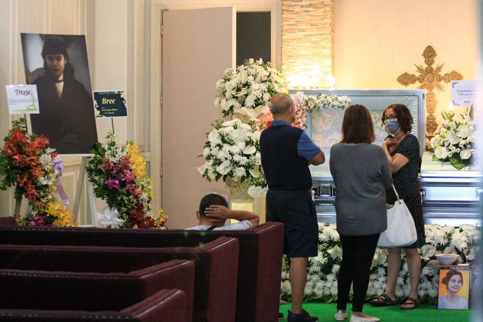 Sally Jonson (right) entertains visitors at the wake of her daughter, Bree Jonson, at a funeral home in Davao City on September 27, 2021. Manman Dejeto, ABS-CBN News