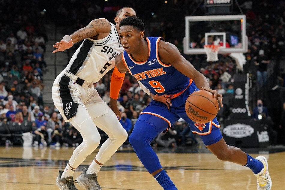 New York Knicks guard RJ Barrett (9) dribbles against San Antonio Spurs guard Dejounte Murray (5) in the second half at the AT&T Center. Daniel Dunn, USA TODAY Sports/Reuters