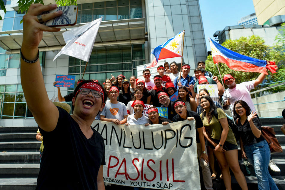 Youth leaders from various organizations conduct a protest in front of the Chinese Consulate in Makati on the eve of Philippine Independence Day, Tuesday. George Calvelo, ABS-CBN News/file