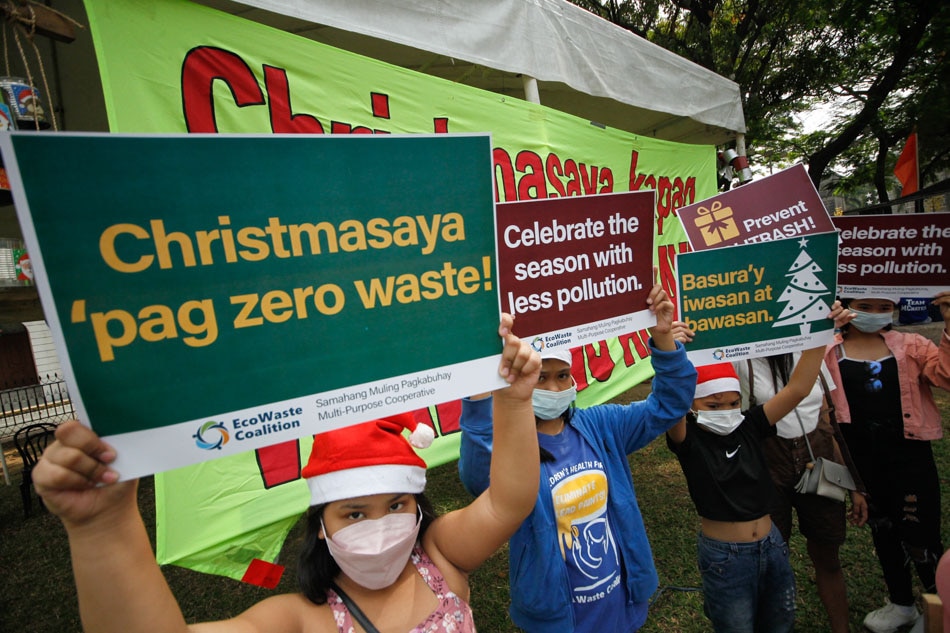 Children join members of Caritas Philippines and Eco-Waste Coalition during a zero waste campaign event at the Plaza Roma in Intramuros Manila on Sunday. The group encouraged the public to prevent and reduce trash during the festive Christmas and New Year celebrations to address environmental pollution.