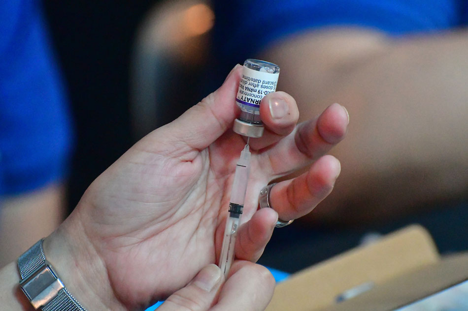 Medical staff of the National Kidney and Transplant Institute in Quezon City prepares the COVID-19 vaccine booster shots to be administered to hospital workers on November 17, 2021. Mark Demayo, ABS-CBN News