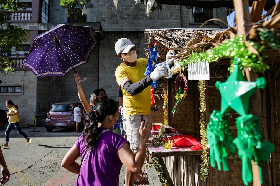 Vendors start assembling their booths at the parking area of the Diocesan Shrine of St. Joseph, Las Piñas, more popularly known as the Bamboo Organ Church on December 14, 2021. Different Catholic churches have started preparing for the traditional Simbang Gabi which will begin dawn of December 16. George Calvelo, ABS-CBN News