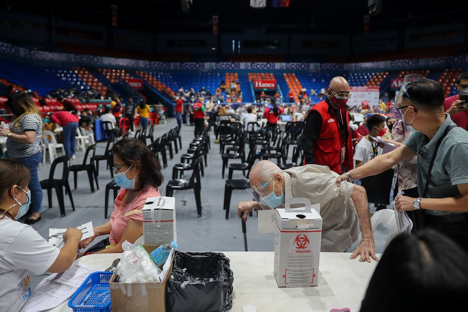 Senior citizens receive their Covid-19 vaccine booster shots at the Filoil San Juan Arena in San Juan City on Dec. 3, 2021. Jonathan Cellona, ABS-CBN News/File