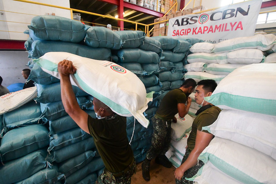 Members of the 7th Marine Brigade load up relief packs from the ABS-CBN Sagip Kapamilya Warehouse in Quezon City on Dec. 21, 2021, for victims of Typhoon Odette. Mark Demayo, ABS-CBN News