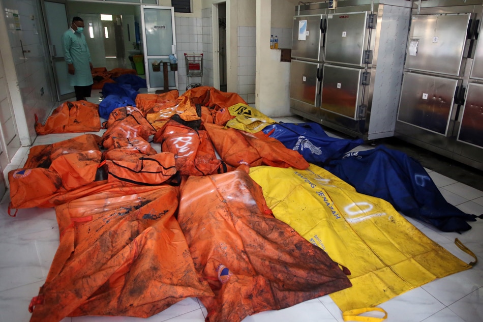 Bags containing the bodies of victims of a prison fire are pictured at a local hospital waiting to be sent to the police hospital for identification following a fire overnight at an overcrowded jail in Tangerang on the outskirts of Jakarta, Indonesia, Sept. 8, 2021. Muhammad Iqbal, Antara Foto/Reuters
