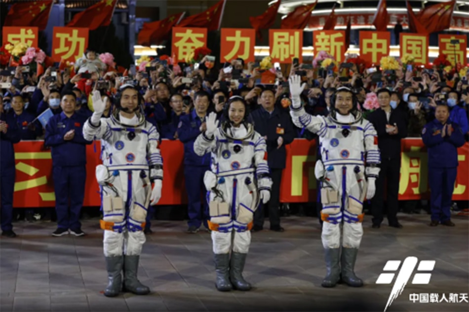 These three astronauts, seen here at a sendoff ceremony, have docked at China's new space station. Photo from the China Manned Space Agency website