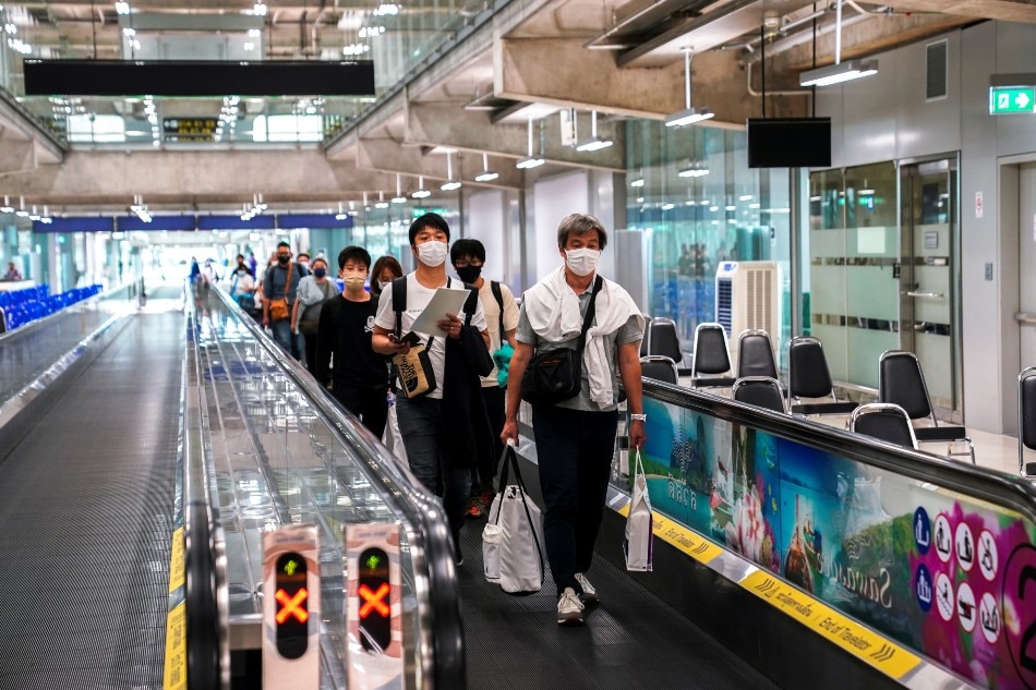 Foreign tourists arrive at Suvarnabhumi Airport during the first day of the country's reopening campaign, part of the government's plan to jump-start the pandemic-hit tourism sector in Bangkok November 1, 2021. Athit Perawongmetha, Reuters/file
