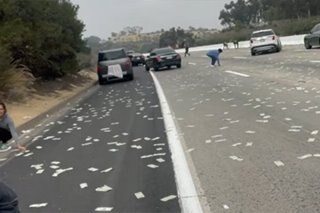 One truck’s cash spill is other motorists’ gold?
