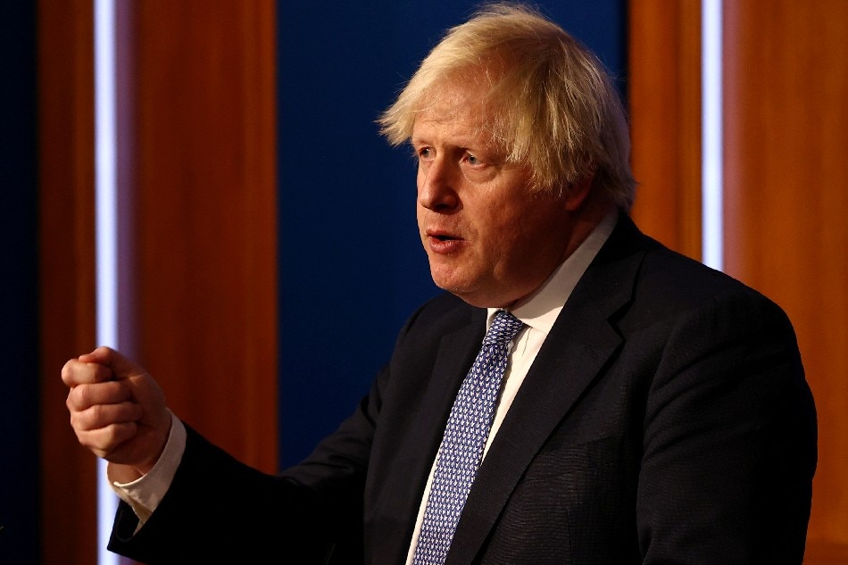 British Prime Minister Boris Johnson holds a news conference for the latest coronavirus disease (COVID-19) update in the Downing Street briefing room, in London, Britain December 8, 2021. Adrian Dennis/Pool via REUTERS/File Photo