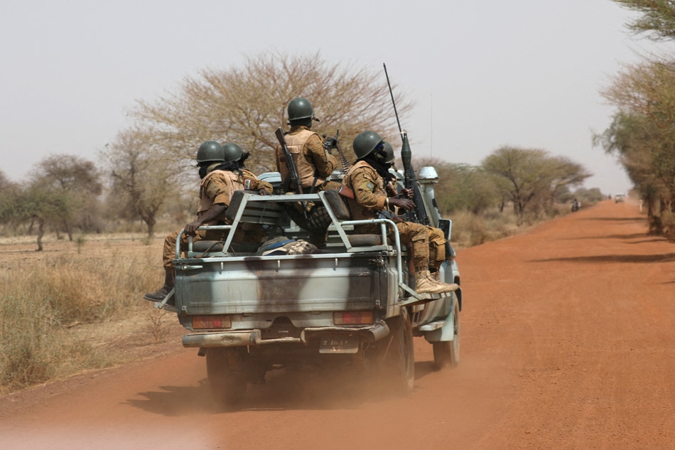 Soldiers from Burkina Faso patrol on the road of Gorgadji in the Sahel area, Burkina Faso March 3, 2019. Picture taken March 3, 2019. REUTERS/Luc Gnago/File Photo/File Photo