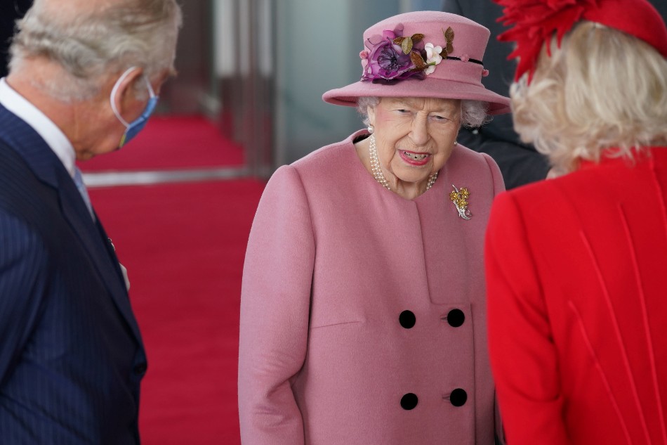 Britain's Queen Elizabeth, accompanied by the Prince Charles and Camilla, Duchess of Cornwall, attends the opening ceremony of the sixth session of the Senedd in Cardiff, Britain October 14, 2021. Jacob King/Pool via Reuters
