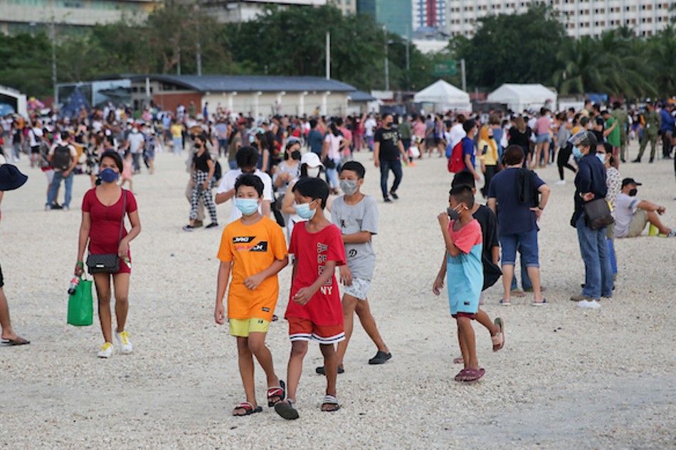 People flock to the Manila Baywalk Dolomite Beach to watch the sunset on October 21, 2021. George Calvelo, ABS-CBN News