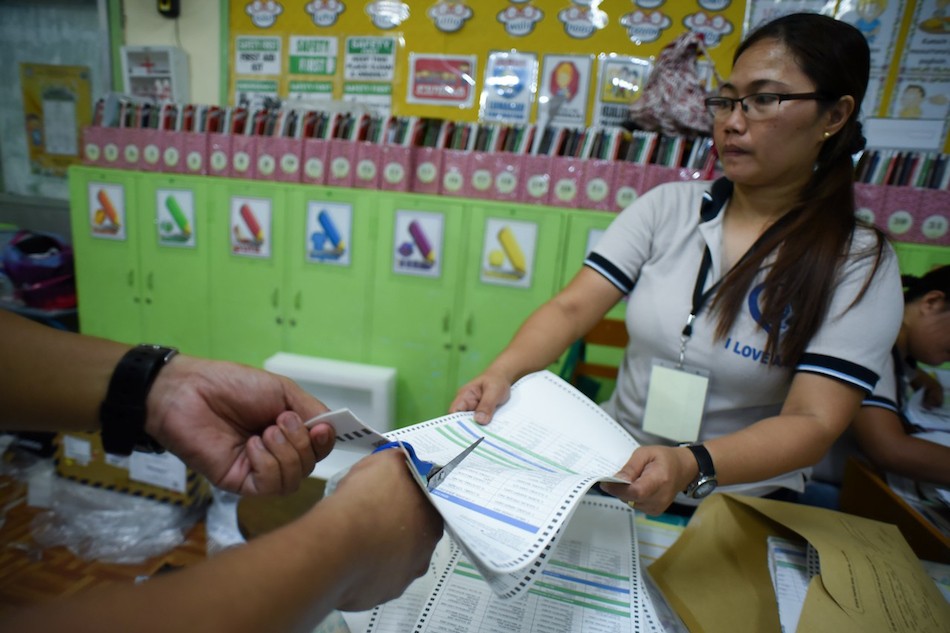 Teachers and volunteers destroy remaining excess ballots as they wrap up at a polling precinct in Aurora A. Quezon elementary school in Manila on May 13, 2019. George Calvelo, ABS-CBN News/File