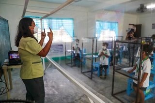 Filipino kids back in public schools for pilot in-person classes