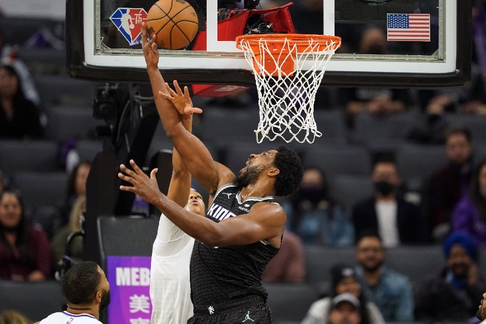 Sacramento Kings forward Marvin Bagley III (right) scores while being fouled by LA Clippers guard Brandon Boston Jr. (4) during the fourth quarter at Golden 1 Center. Darren Yamashita, USA TODAY Sports/Reuters.