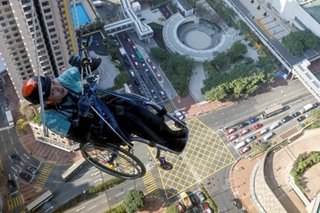 Paraplegic climbs 320-meter tower in HK