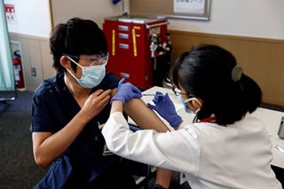 Japan launches COVID-19 vaccinations as Olympics approach
