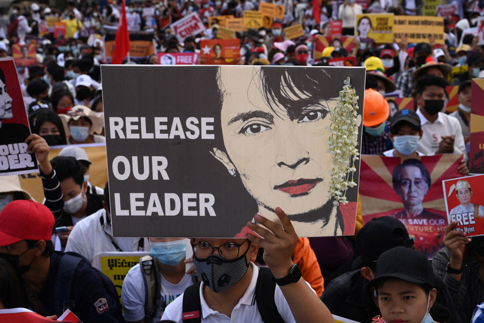 Protesters call for the release of detained Myanmar civilian leader Aung San Suu Kyi as they block a road during a demonstration against the military coup in Yangon on Feb. 17, 2021. Sai Aung Main, AFP 
