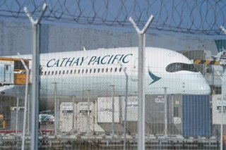 Cathay Pacific posts record loss, warns of long recovery
