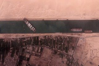 Suez Canal could be blocked for weeks by 'beached whale' ship