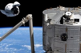 Recycled SpaceX capsule successfully docks to International Space Station