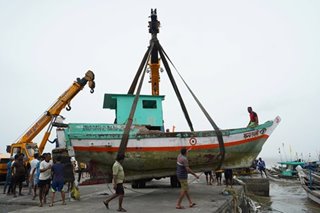 Indian navy searches for 77 missing from barge sunk by cyclone