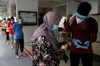 Singapore to ease curbs as coronavirus cases fall