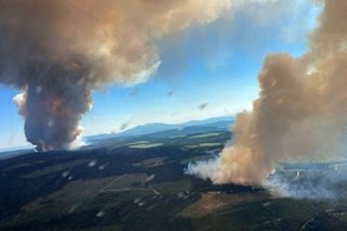 Military put on standby to evacuate fire-threatened towns in western Canada