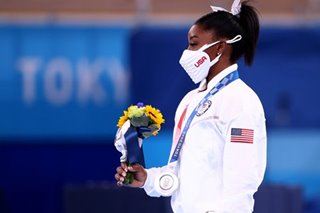 Biles' Olympic fate in balance as support pours in