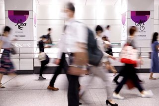 Japan to expand virus emergency 1 week into Olympics