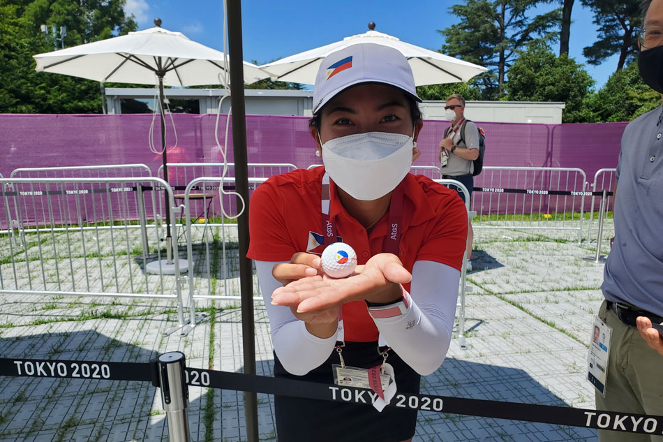 Bianca Pagdanganan, a golfer from Philippines, shows off a ball carrying Philippines flag on it, in Kasumigaseki Golf Club in Kawagoe city in Saitama prefecture, Japan, August 4, 2021.