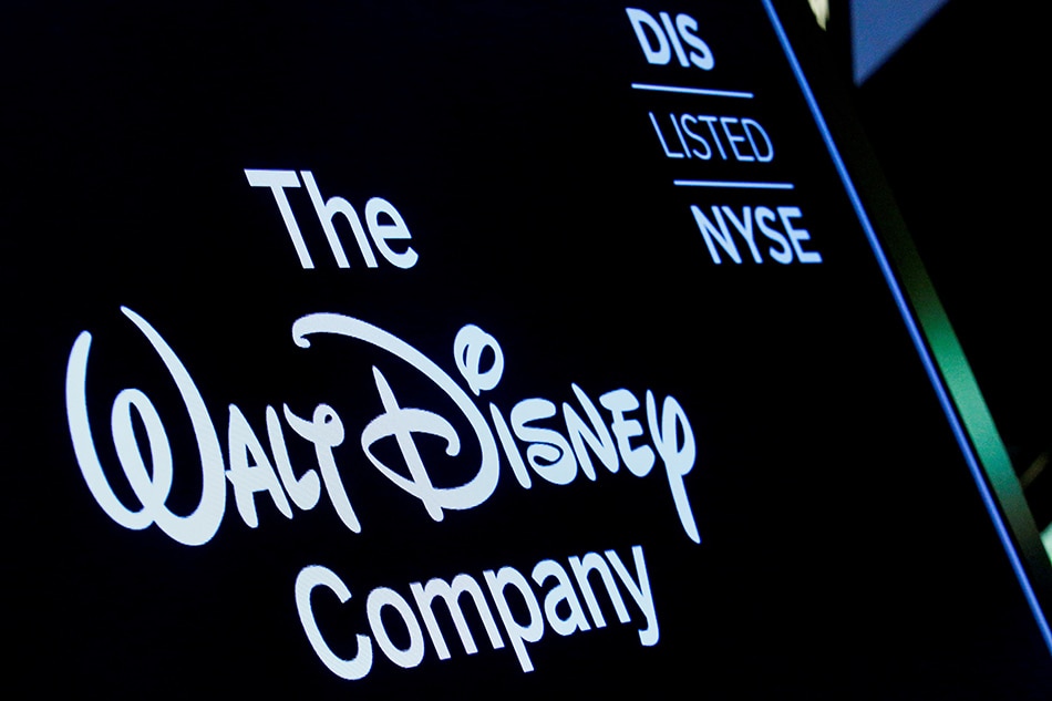 A screen shows the logo and a ticker symbol for The Walt Disney Co. on the floor of the New York Stock Exchange in New York, on December 14, 2017. Brendan McDermid, Reuters/file