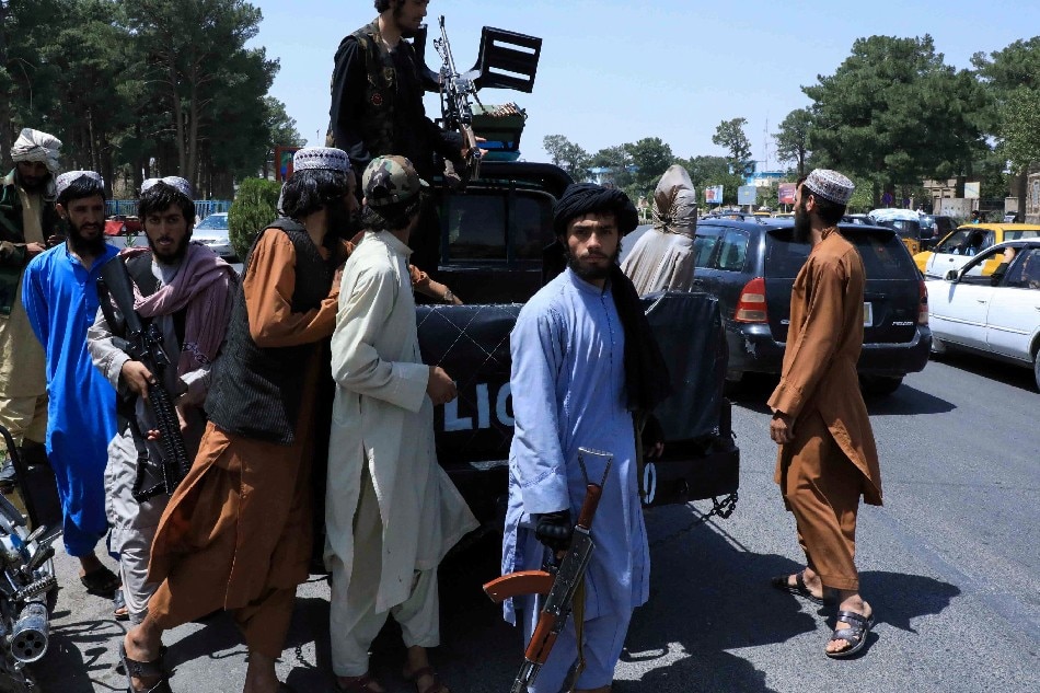 Taliban forces patrol a street in Herat, Afghanistan August 14, 2021. Reuters/Stringer