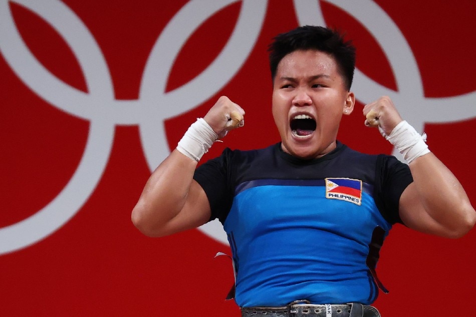 Elreen Ann Ando of the Philippines celebrates after a lift. Edgard Garrido, Reuters