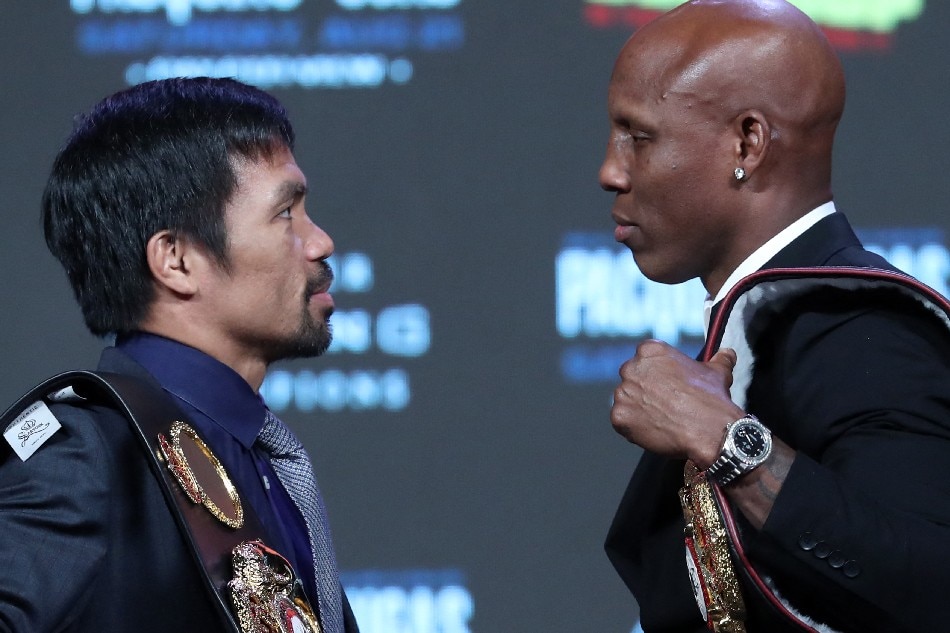 Manny Pacquiao (L) and WBA welterweight champion Yordenis Ugas face off during a news conference at MGM Grand Hotel & Casino on August 18, 2021 in Las Vegas, Nevada. Pacquiao will challenge Ugas for the title at MGM Grand Garden Arena on August 21 in Las Vegas. Steve Marcus, Getty Images/AFP