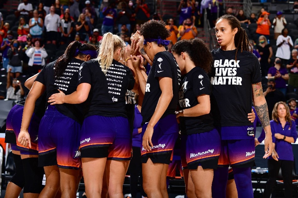 The Phoenix Mercury huddle up before the game against the Minnesota Lynx on July 3, 2021 at the Phoenix Suns Arena in Phoenix, Arizona. File photo. Barry Gossage, NBAE via Getty Images/AFP