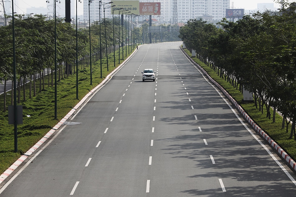 A lone car is seen on an empty highway during lockdown amid the coronavirus disease (COVID-19) pandemic in Ho Chi Minh, Vietnam, August 23, 2021. 
