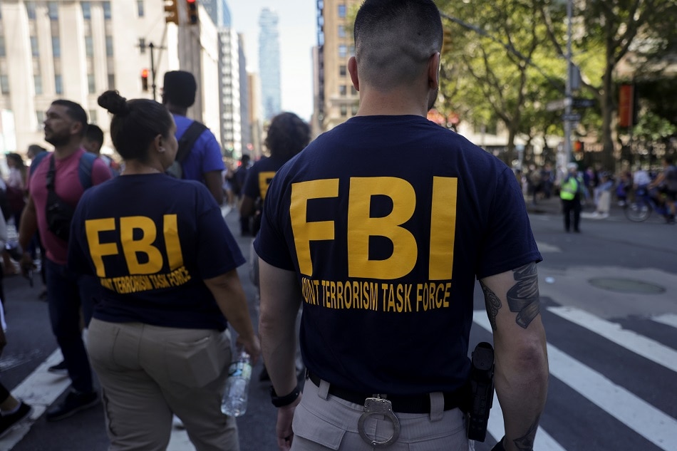 FBI agents stand guard near One World Trade Center during the 20th anniversary of the September 11, 2001 attacks in New York City, New York, U.S., September 11, 2021. Jeenah Moon, Reuters