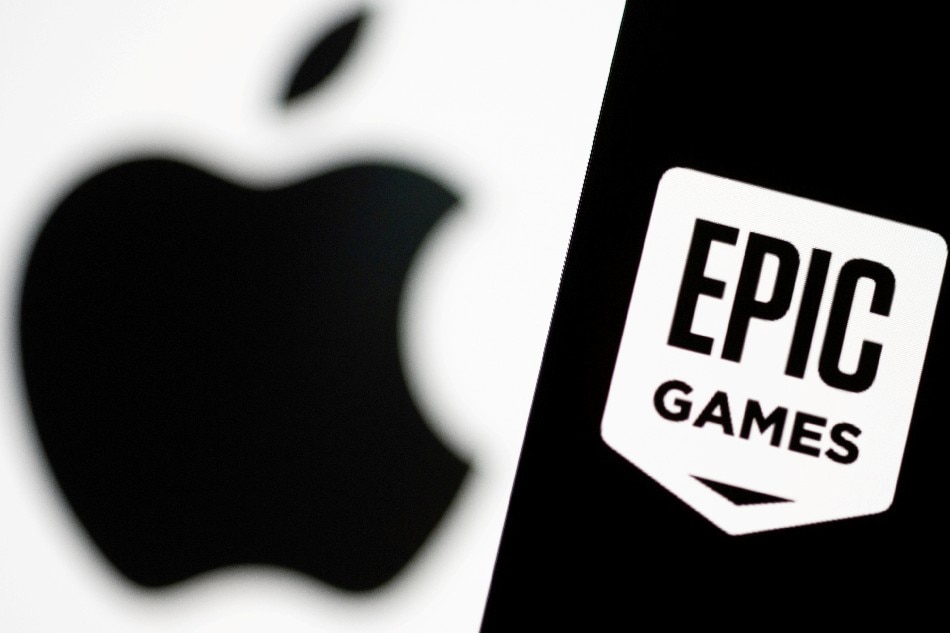 Smartphone with Epic Games logo is seen in front of Apple logo in this illustration taken, May 2, 2021. Dado Ruvic, Reuters/Illustration/File Photo