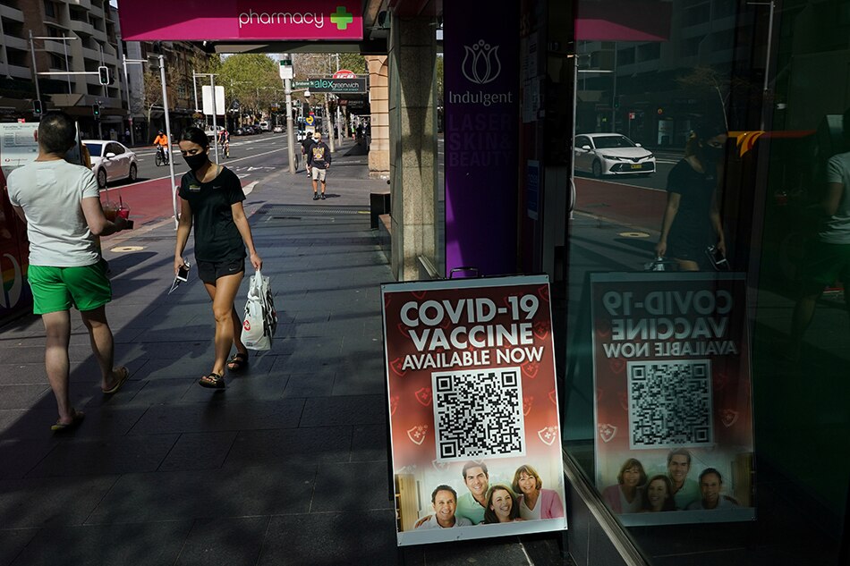 A sign advertises the availability of COVID-19 vaccine doses at a city centre pharmacy during a lockdown to curb the spread of COVID-19 outbreak in Sydney, September 9, 2021. Loren Elliott, Reuters