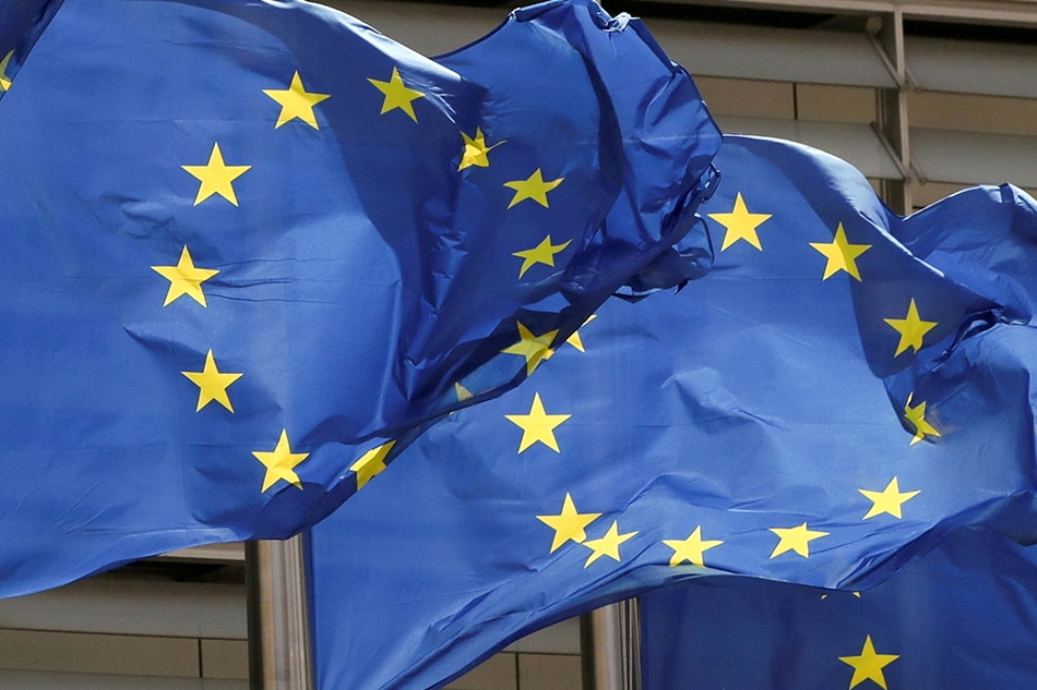 European Union flags flutter outside the EU Commission headquarters in Brussels, Belgium May 5, 2021. Yves Herman, Reuters/File Photo