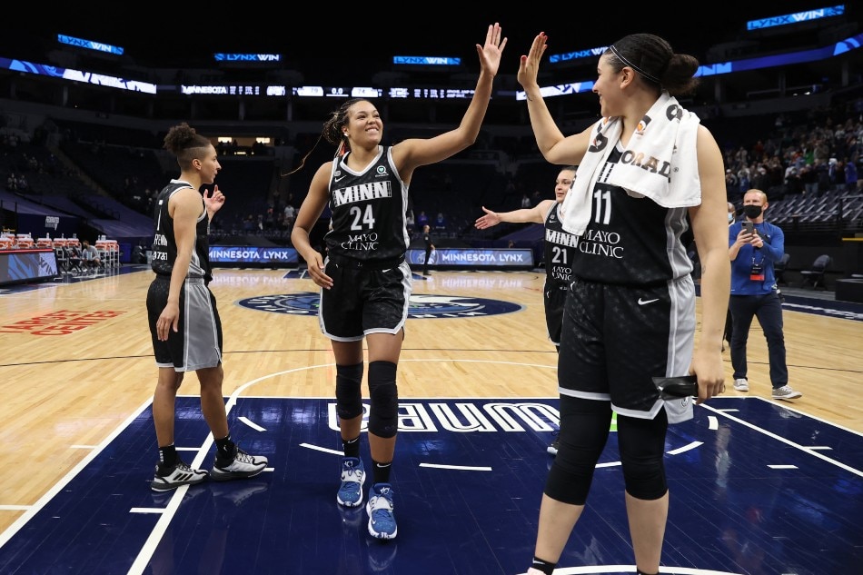 Napheesa Collier #24 of the Minnesota Lynx high-fives teammate Natalie Achonwa #11 after the game against the Connecticut Sun on May 30, 2021 at Target Center in Minneapolis, Minnesota. File photo. David Sherman/NBAE via Getty Images/AFP.