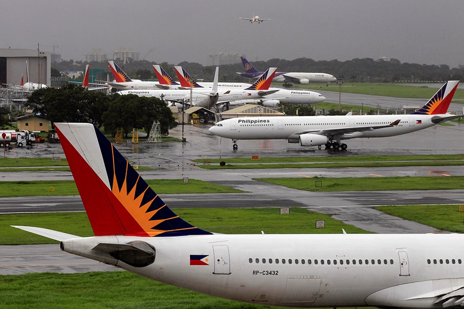 Des avions de Philippine Airlines (PAL) sont stationnés sur le tarmac de l'aéroport international de Manille à Pasay, dans le métro de Manille, le 9 septembre 2014. Romeo Ranoco, Reuters/File Photo