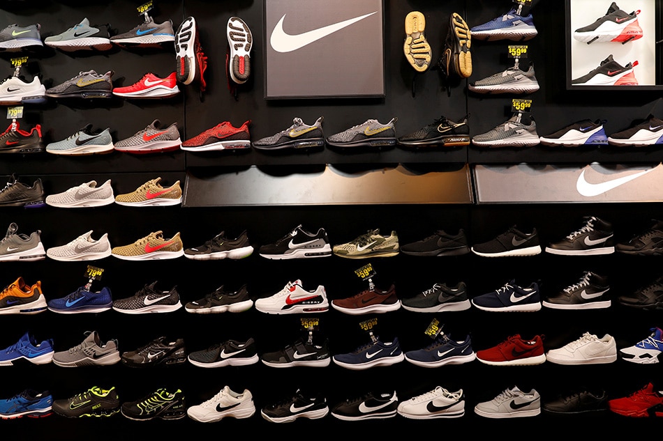 Nike shoes are seen displayed at a sporting goods store in New York City, in May 2019. The sports giant is dealing with closures of major factories in Vietnam and Indonesia due to restrictions because of COVID-19, a Nike official says. Mike Segar, Reuters/file